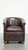 A beautiful luxurious dark cowhide club chair with ball legs in English style. This comfortable cowhide leather club chair...