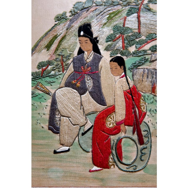 This authentic two-panel Korean screen is from the 20th Century and is highlighted with the design of two painted silk...