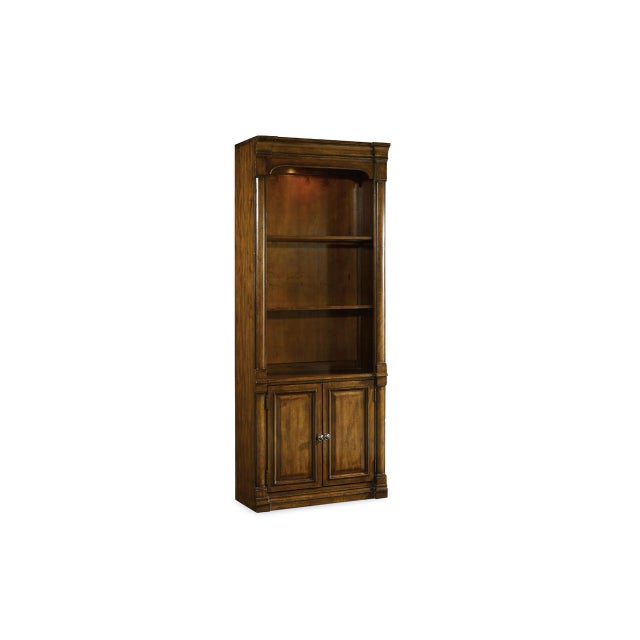 Historic traditional bookcase with columns, lower storage, open shelving, and a lighted display case. Finished in a warm...