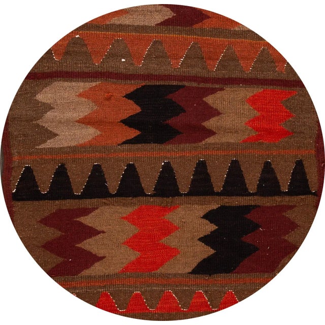 A beautiful hand-woven vintage Kilim runner with a tan field, and multi-color accents an all-over geometric design. This...