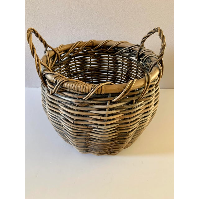 This is a vintage harvest basket. The large woven basket features double handles.. A great catchall, the basket's dynamic...