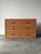 Fully wrapped in woven wicker, this vintage six-drawer dresser is finished with hand-braided rope trim outlining every...