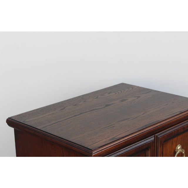 Pair of walnut nightstands by Conan Ball Furniture These nightstands are solid built and in great condition. Dimensions:...