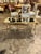 The Italian Maison Bagues Design Gilt Brass Coffee Table is a luxurious and stylish piece of furniture for any home. This...