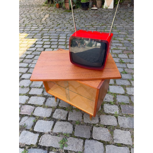 A thoughtfully designed and highly functional piece of German mid-century design: This compact television cabinet, crafted...