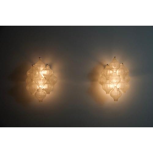 This elegant pair of “tulipan” wall lamps was produced by j.t. Kalmar in austria during the 1960s. The design beautifully...