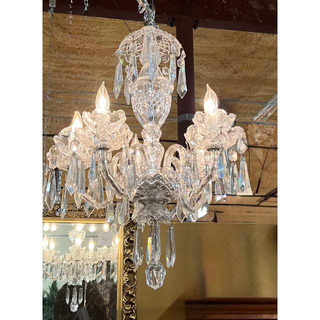 This is a beautiful 5 arm Waterford crystal chandelier. No broken or damaged areas.