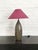 A striking handcrafted ceramic table lamp featuring an elegant elongated baluster form, decorated with an all-over...