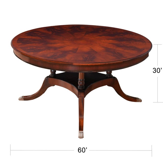 A Sixty Inch Round Mahogany Dining Table from Niagara Furniture produced with a high quality figured mahogany field and...