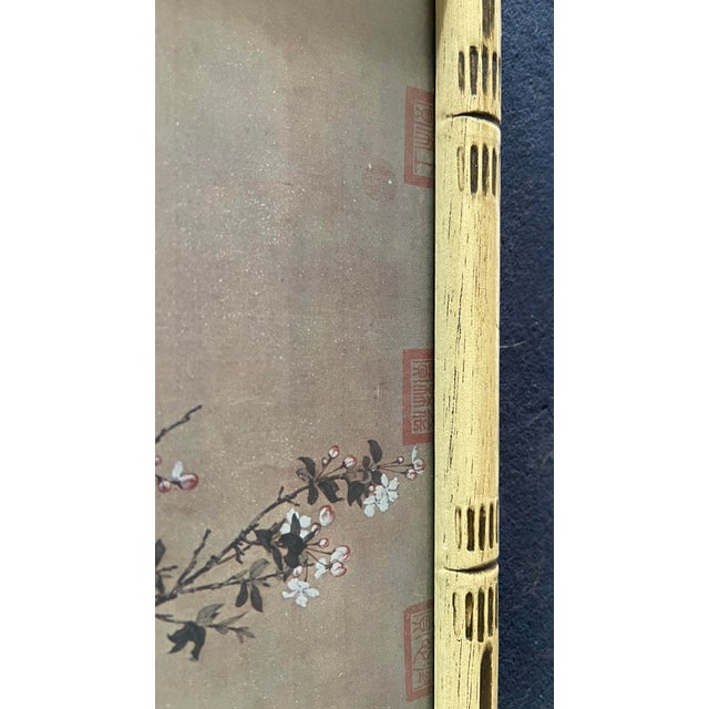 A charming vintage chinoiserie print depicting golden pheasants among flowering branches and garden rocks, after the...