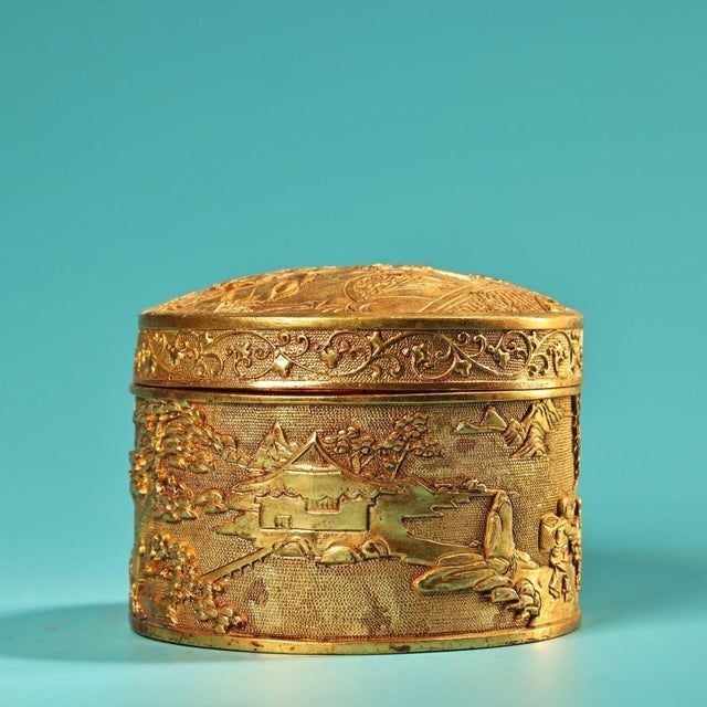 This exquisite vintage trinket box is a beautiful example of traditional metalwork, crafted from bronze with a rich,...
