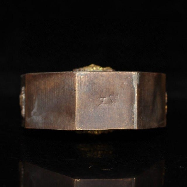 This impressive vintage Chinese snuff bottle is crafted from bronze, featuring a unique octagonal (eight-sided) body. The...
