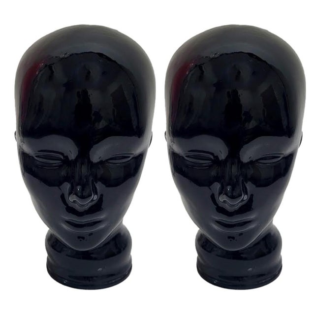Bring a bold, graphic punch to your library or shelving with this striking pair of vintage 1970s glossy black glass...