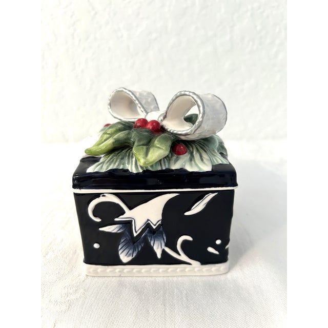 Lovely Fitz and Floyd ceramic lidded trinket/candy box in their Bristol Holiday pattern. Box resembles a gift wrapped in a...