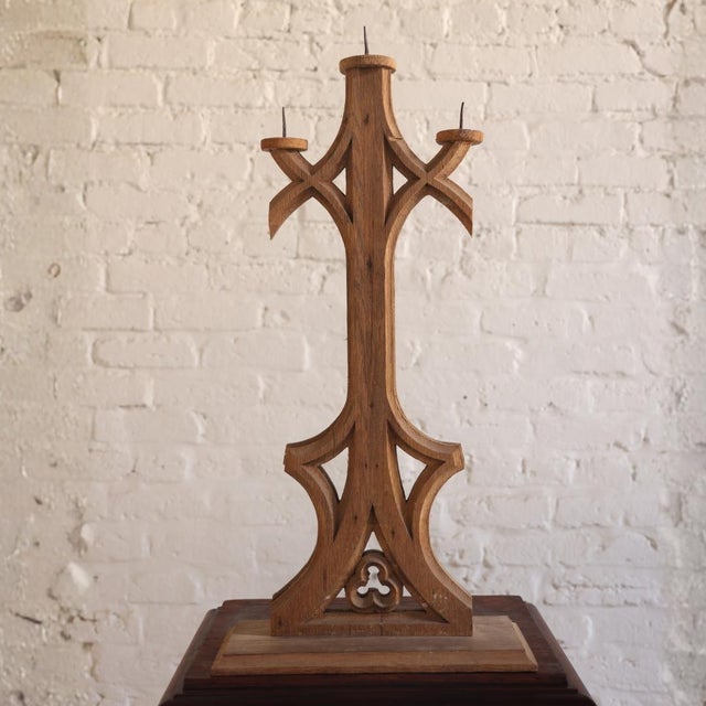 A elegant 1920s French oak candelabra, crafted with the graceful proportions and refined decorative carving that defines...