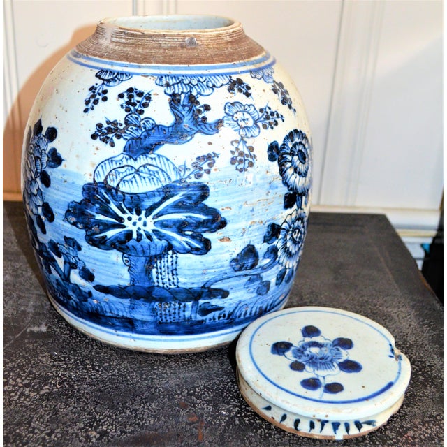 This is a beautiful large blue & white Chinese porcelain ginger jars. This large rounded jar has a unique large floral...