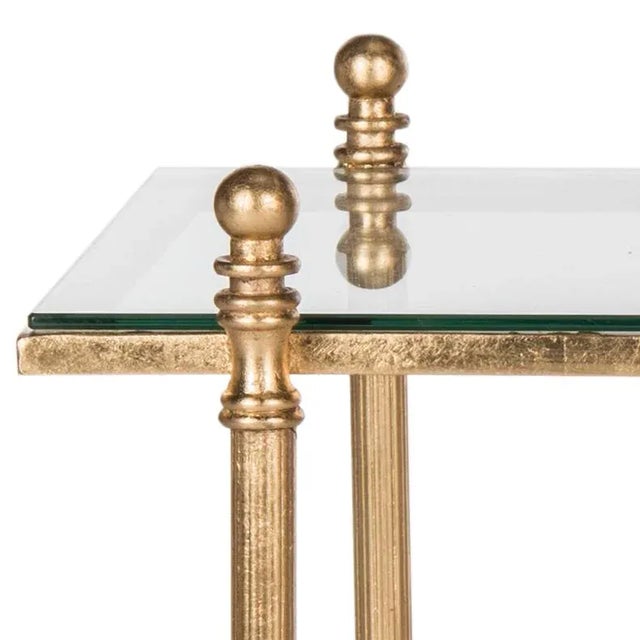 Modeled after a masterfully crafted antique, this gilt and glass coffee table lends a air of timeless sophistication to...