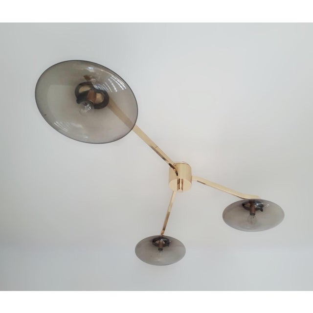 Italian flush mount with three smoky Murano glass shades tiered at different heights, mounted on solid brass frame in...