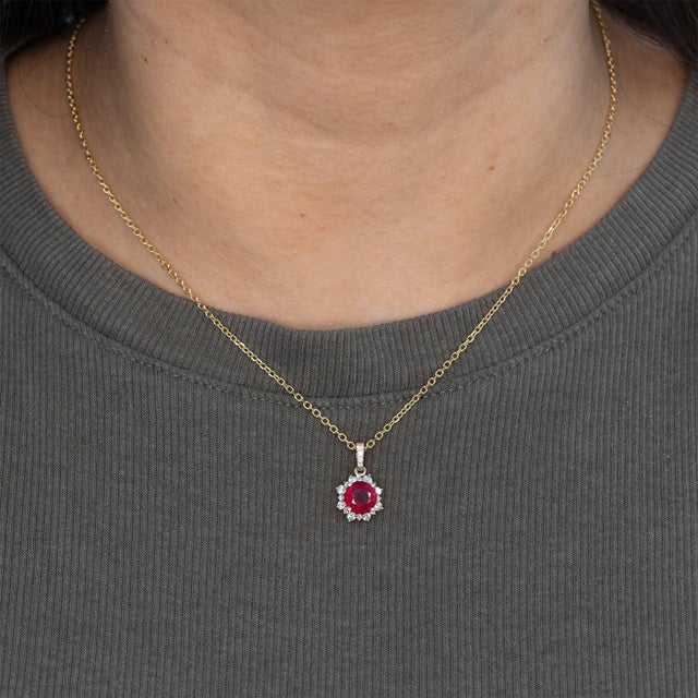 Elevate your jewelry collection with this stunning 1.9 carat Madagascar ruby pendant, celebrated for its deep crimson hue...