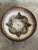 This vintage stoneware deep fruit bowl exhibits a classic circular form highlighted by an intricate incised geometric...