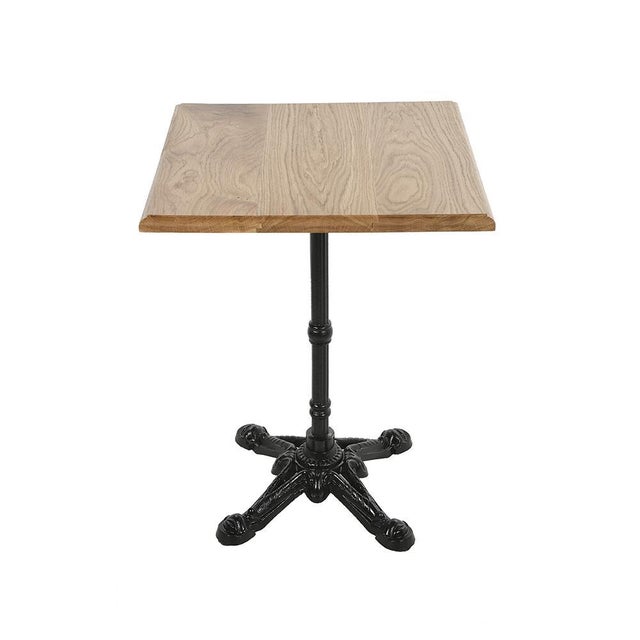 Square bistro table, wooden top and cast iron foot. This piece is designed in the style of the selected designer and/or...