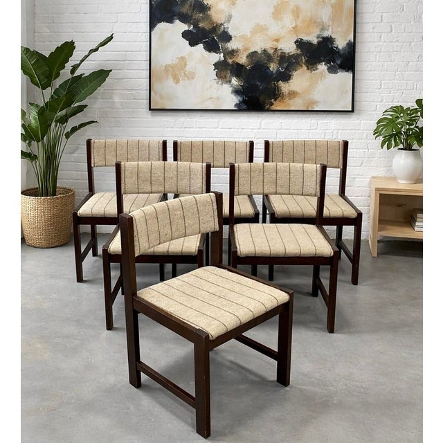 Set of six Mid Century Modern dining chairs manufactured by Faarstrup, Denmark, c. 1960s. Each chair features a solid...