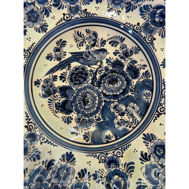 Beautiful large Delftware platter. The center medallion features a bird perched on flowering branches — a classic...