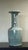 Presenting a substantial and beautifully crafted 18-inch tall celadon porcelain vase. This impressive piece features...