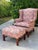 Vintage American flamestitch wingback chair and matching ottoman, featuring a vibrant coral, pink, cream, and olive...