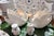 A pair of vintage white glazed ceramic swan planters featuring textured feather details and curved necks. The perfect...