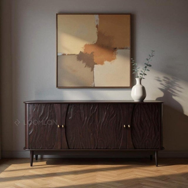 The Rhovira 4 Door Sideboard is perfect for anyone looking to add a touch of elegance to their home. With its sleek black...