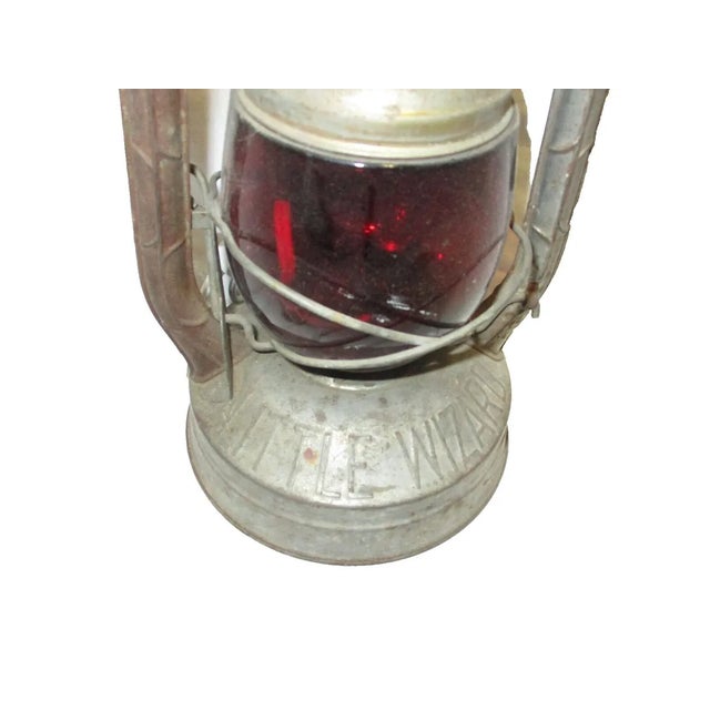 Vintage Lantern with red glass globe.In good condition and will look used. Vintage item. Power cord and light was added...