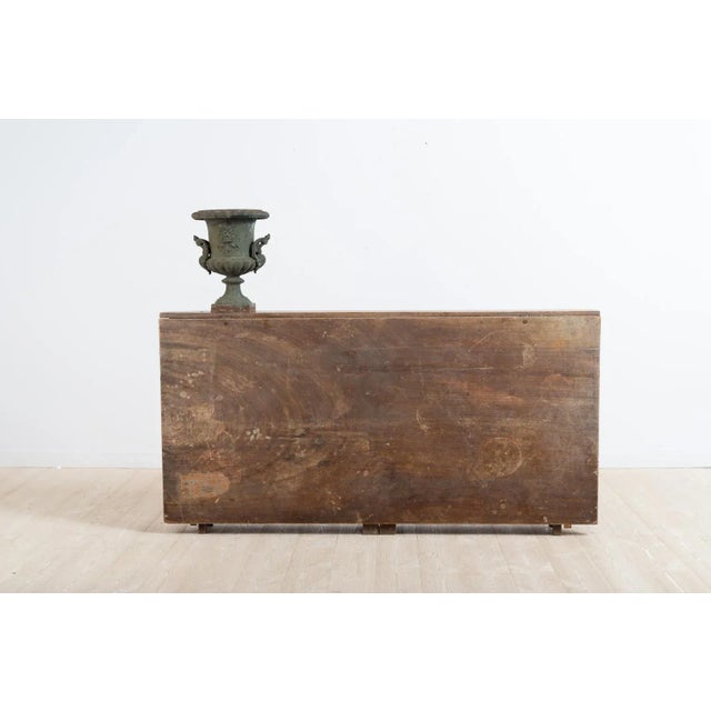 Late 18th century Swedish drop-leaf table from the Gustavian era. The model is very unusual with a middle much narrower...