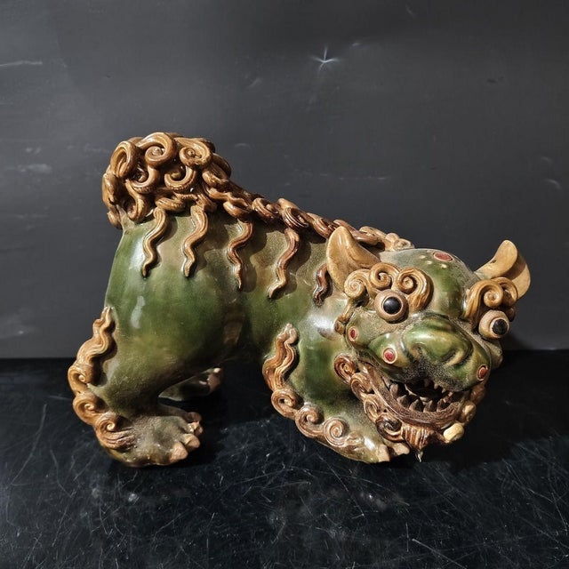 Bring a touch of traditional Asian mystique and auspicious energy to your home with this charming pair of vintage Shiwan...