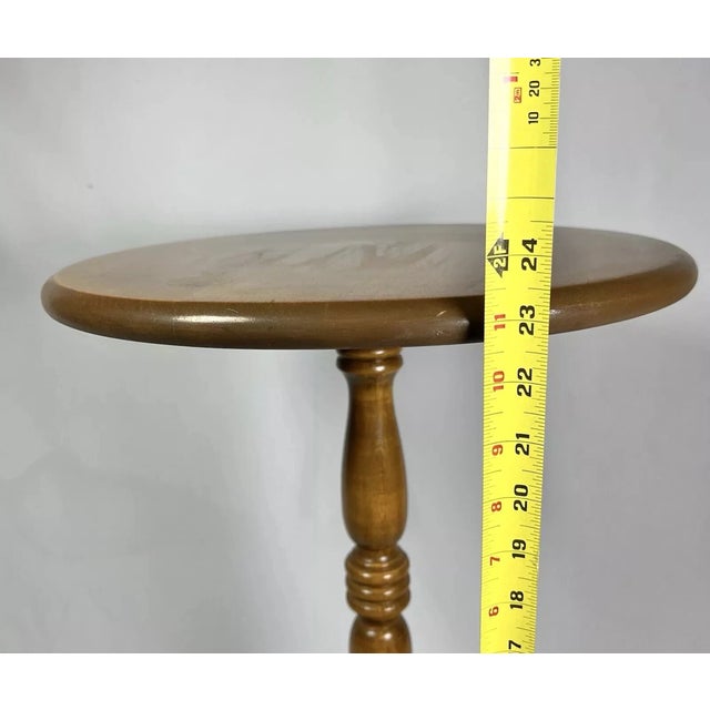Add classic American craftsmanship to your home with this Vintage Ethan Allen Heirloom Maple “Nutmeg” Round Side Table....