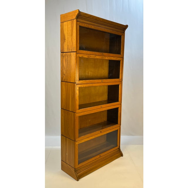 An exceptional early 20th-century five-tier "sectional" barrister bookcase by Gunn Furniture Company of Grand Rapids,...