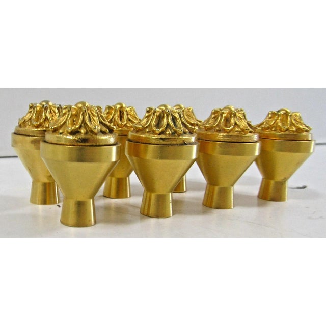 Sherle Wagner Set of Eight 22kt Gold Plated Brass Ribbon & Reed Rosette Cabinet & Drawer Knobs The Ribbon & Reed Rosette...