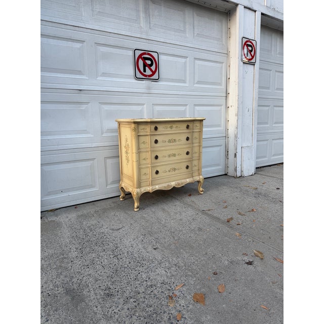 We have a ln absolutely beautiful vintage French Provincial dresser for sale. This charming four drawer chest features an...