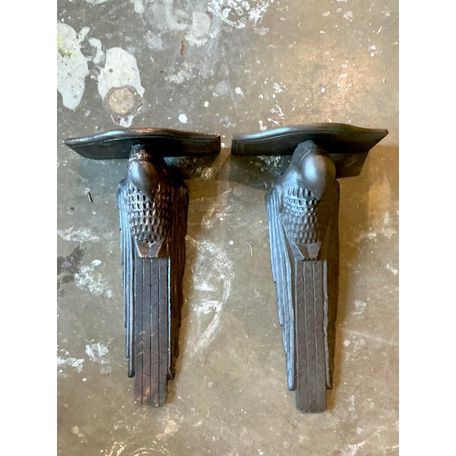 Evoke a sense of global intrigue and artisanal craftsmanship with this captivating pair of Vintage Hand Carved Falcon...
