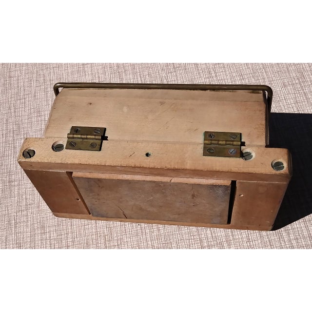 Early American wooden collapsible butter mold with carved interior bottom panel.
