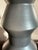 Modern West Elm sculptural ceramic vase featuring a bold geometric silhouette and sophisticated matte gray finish. The...