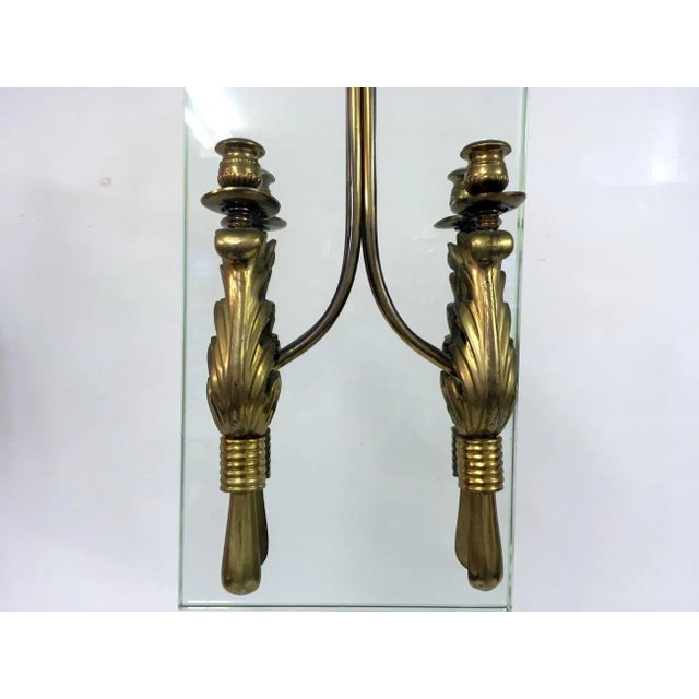 - Chandelier with 4 lights either side of the glass - Features brass fixtures and a thick rectangular sheet of glass -...