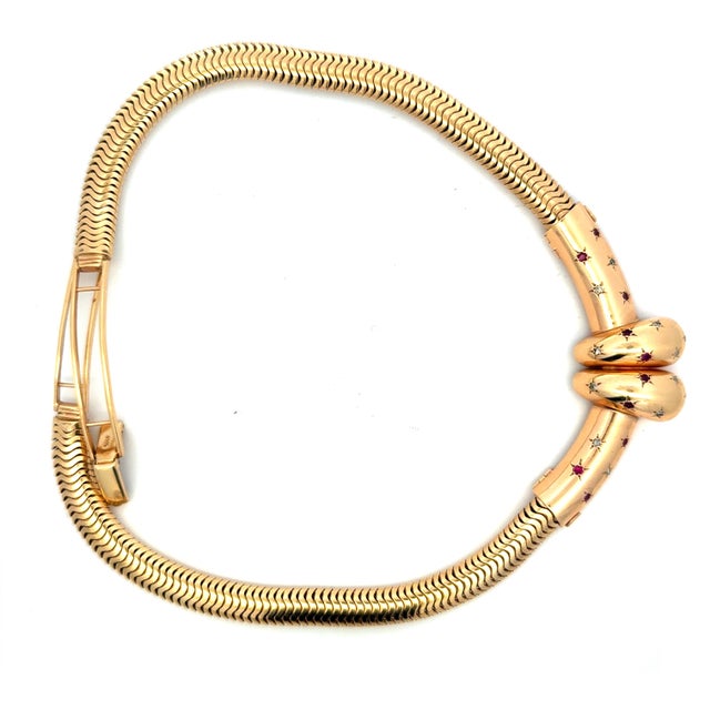A remarkable circa 1940s Retro necklace crafted in substantial 14K yellow gold with a beautifully fluid snake-link...