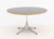 George Nelson for Herman Miller Pedestal Table, black veneered maple top above aluminum base, Herman Miller label to...