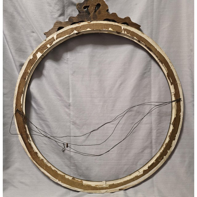 This item is very old and in remarkably great shape! It's a very muted gilt color, and the wire to hang it is also very...