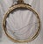 This item is very old and in remarkably great shape! It's a very muted gilt color, and the wire to hang it is also very...