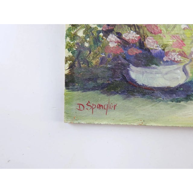 Small oil on masonite garden landscape painting by Dorothy Spangler. Signed lower left corner. Unframed.