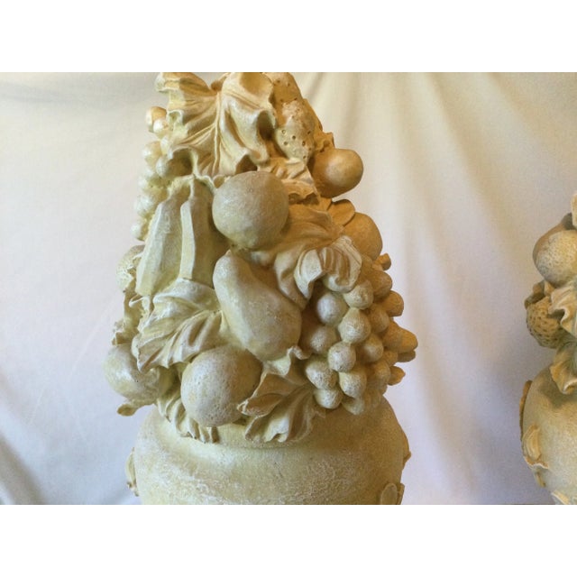 These French Anduze styled sculptures feature a square shaped pedestal with draped garlands or swags. The decorated curved...