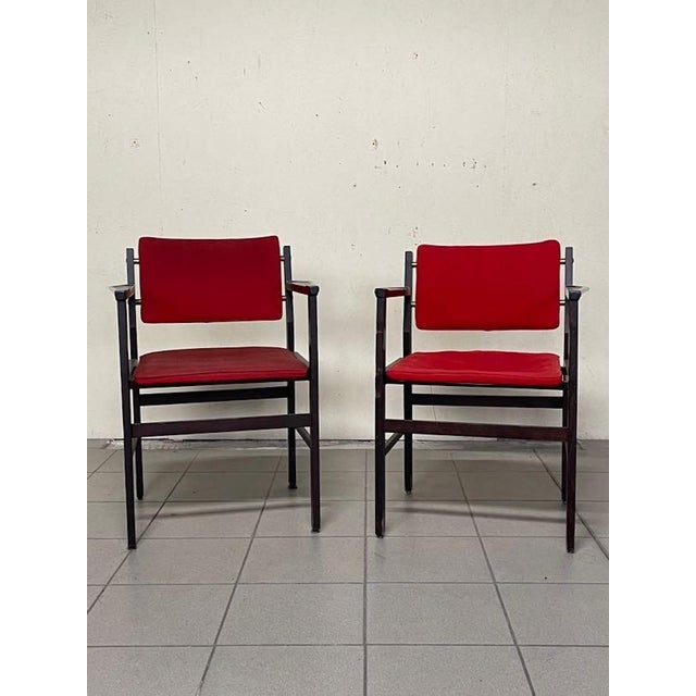 A pair of rationalist-style office chairs dating back to the 1960s. The frame is made of stained beech, with square lines...
