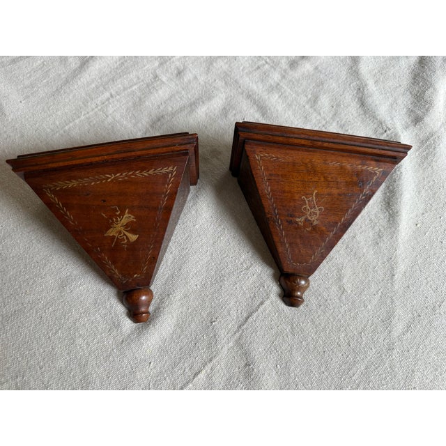 A beautiful pair of vintage Italian wall bracket shelves crafted from a rich mahogany-family hardwood — likely mahogany or...